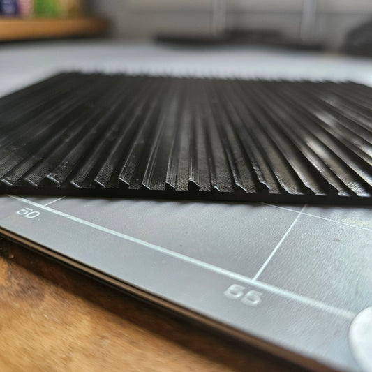 Low Profile Clean-Up Tile